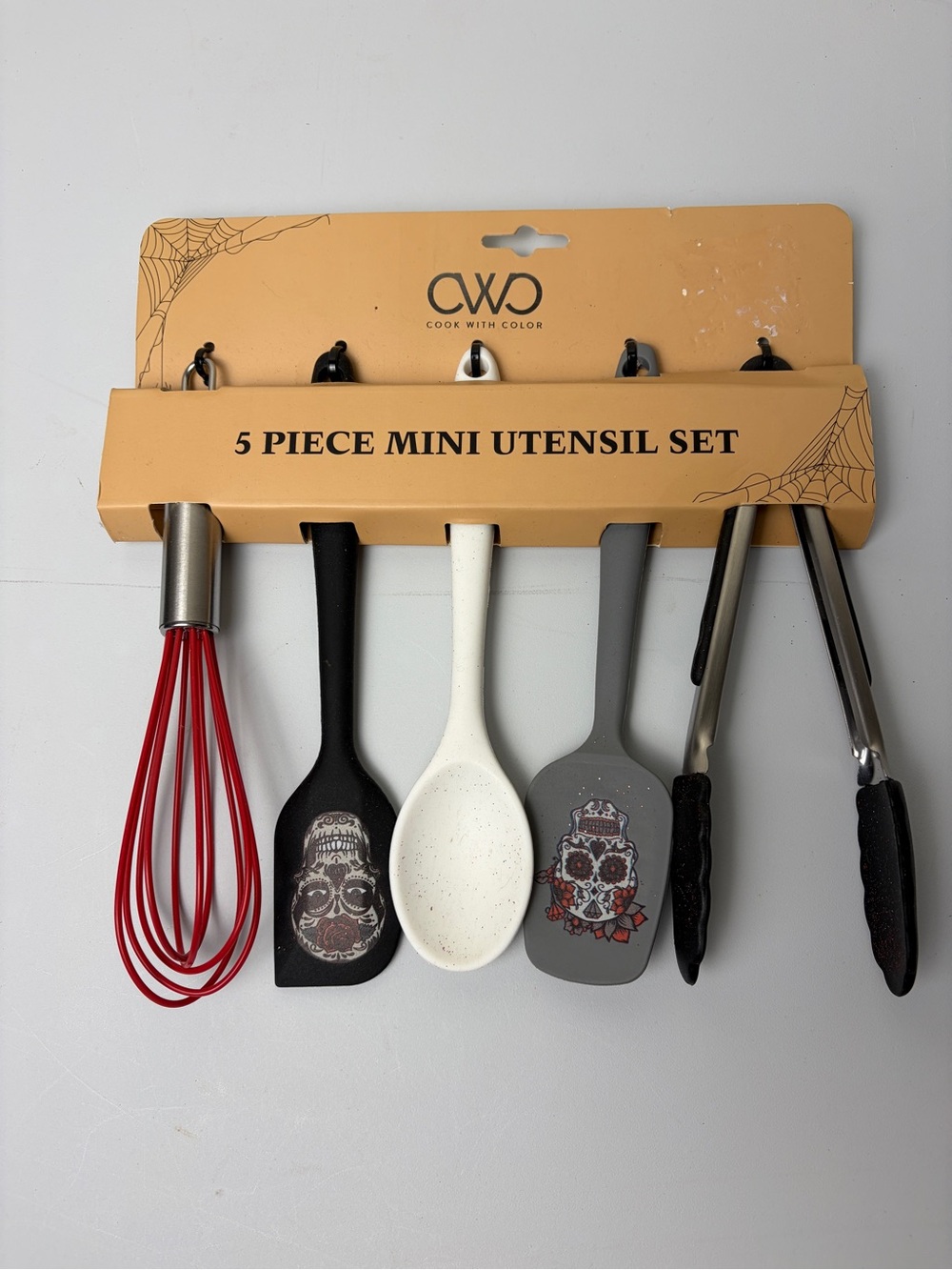 Cook With Color 5-Piece Mini Utensil Set in Red, Black, White, and Gray.